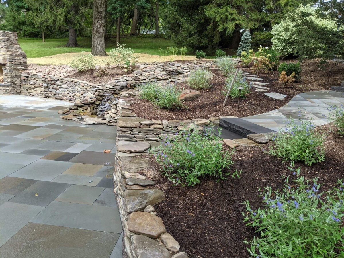 Natural stone retaining wall and water feature