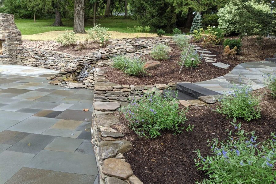Natural stone retaining wall and water feature
